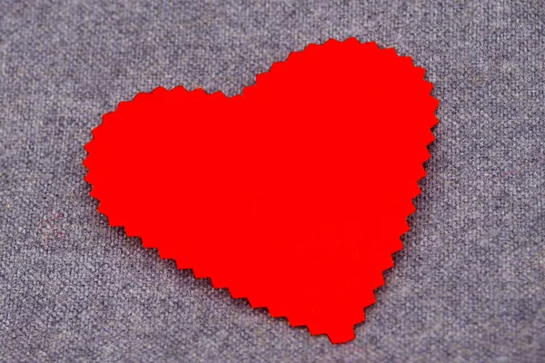 Backgrounds with hearts. Emotions, love, valentine. Paper heart closeup. Background gray textured fabric