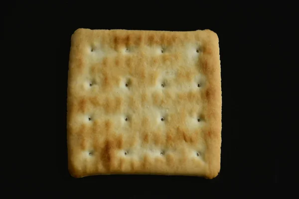 cracker on the black surface