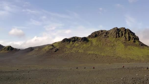 Amazing aerial drone shot of people riding on a path in Iceland — Stock Video