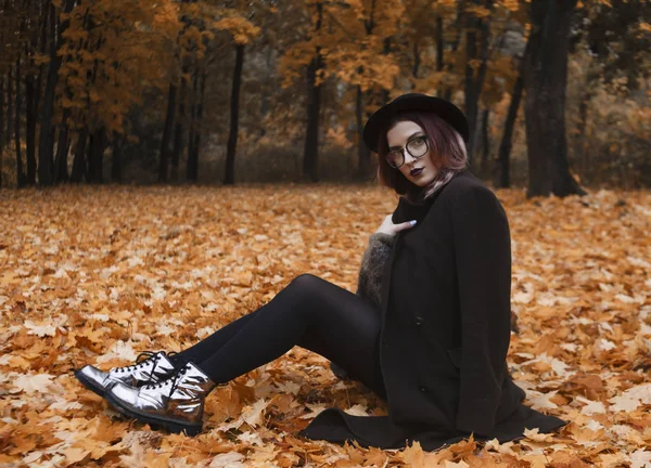 Girl Overcoat Put Sits Hat Background Forest — Stock Photo, Image