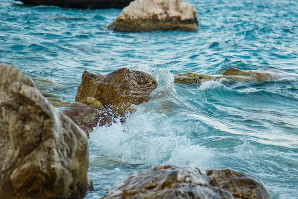 The waves crash on the rocks. The waves crash on the rocks. Waves at sea