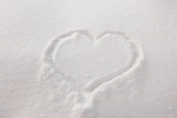 Heart on snow. Cold heart