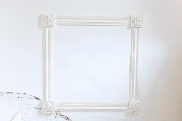 blank vintage white frame on white wall.Copy paste, copy space