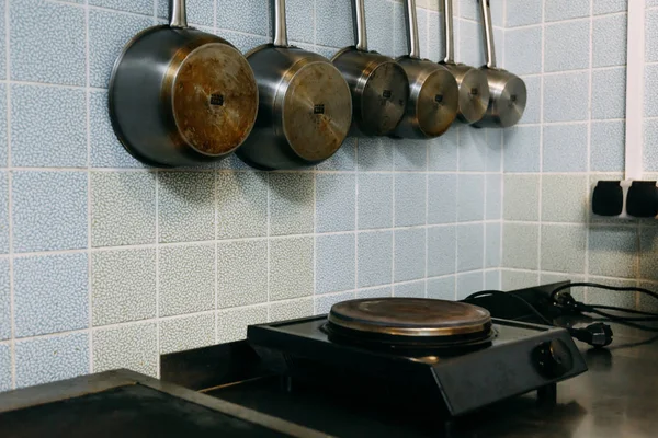 Kitchen wall rack for hanging pots, pans, and other utensils