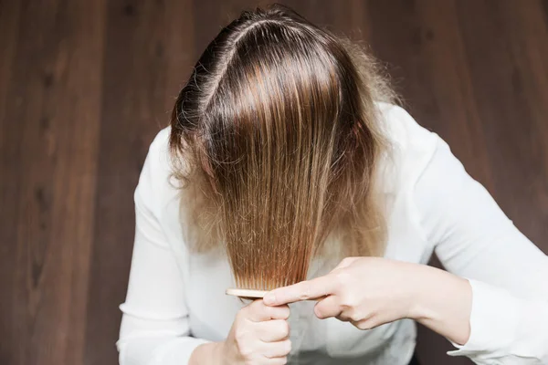 Dark roots of hair, overgrown hair. Hair dyeing