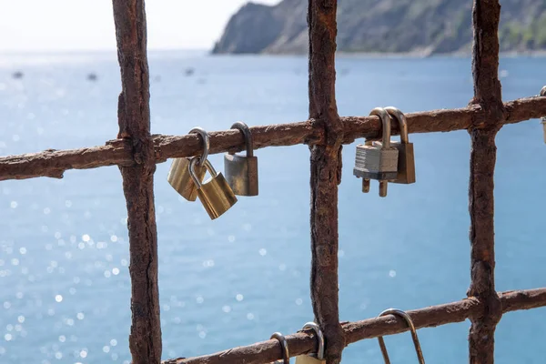 Lot of locks on iron lattice, sea