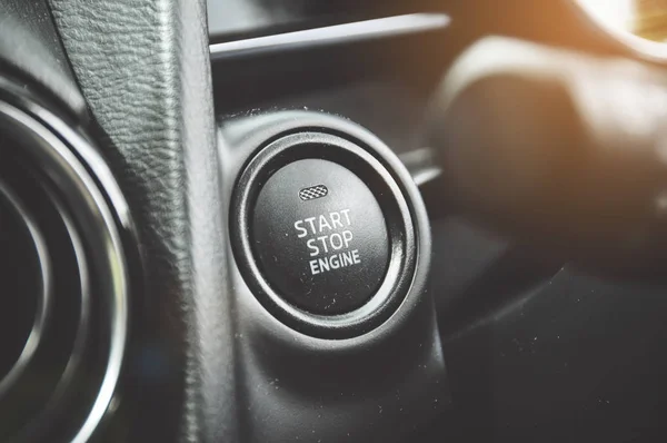 close-up shot of electronic start button in car