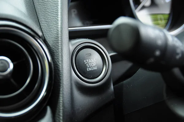 close-up shot of electronic start button in car