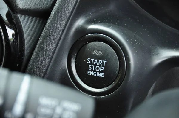 close-up shot of electronic start button in car