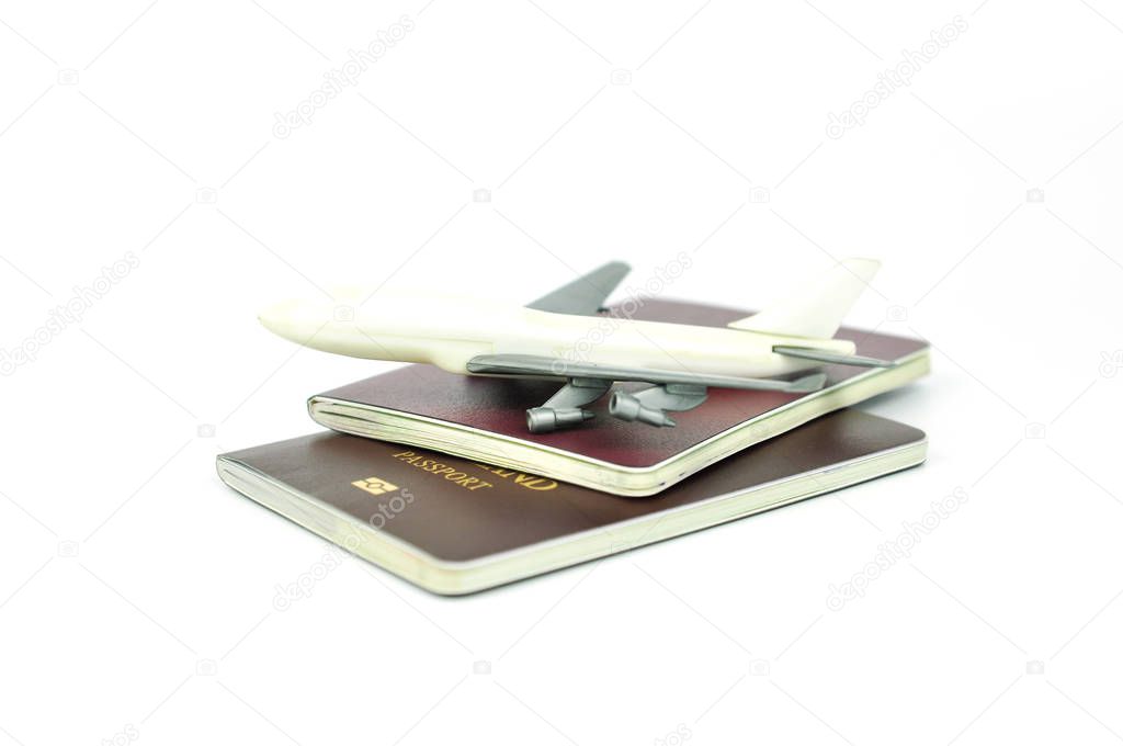 passport and toy airplane. travel concept