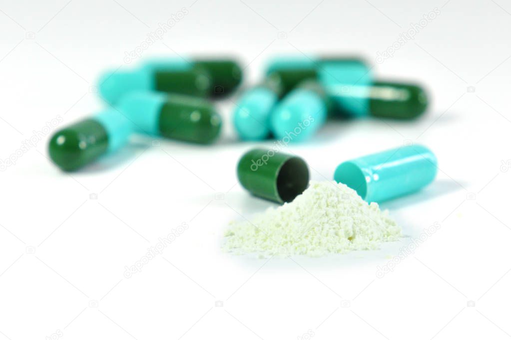 drug capsules on white backgrround
