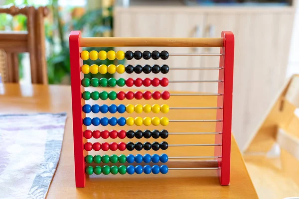 Abacus with red green blue and white balls — Stock Photo, Image