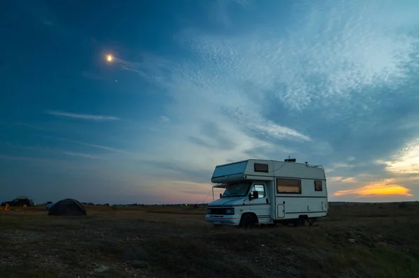 Camper van camping with blue hour sunset