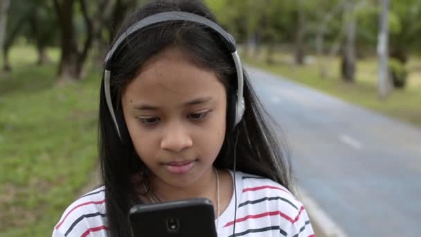 Close Portrait Cute Girl Listening Music Mobile Phone Headset Public — Stock Video