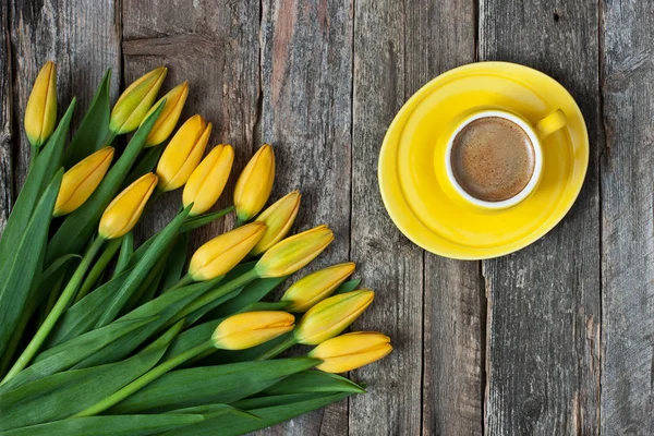 Composition with tulips and coffee cup