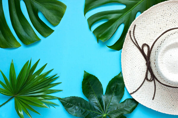 Natural tropical background with straw hat
