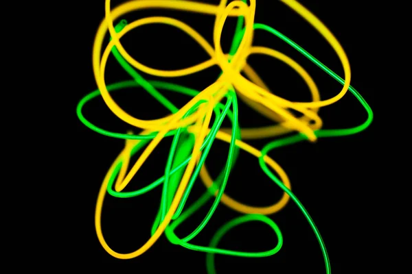 Neon giallo e verde al neon astratto. Linee al neon . — Foto Stock