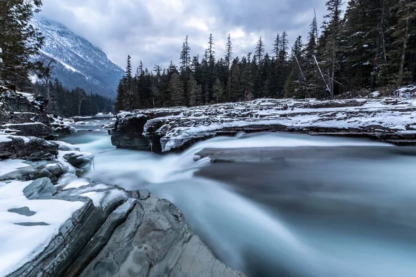 Long exposure of a river in Glacier National Park. Winter.