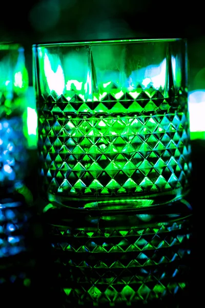 Bar colored lights with glasses of alcohol — Stock Photo, Image