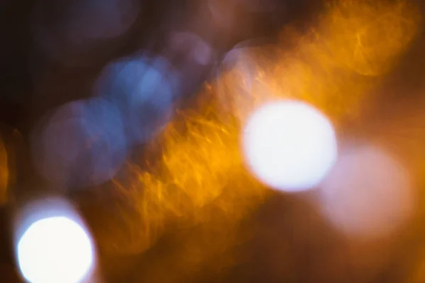 Large gold and silver bokeh on a dark background — Stock Photo, Image
