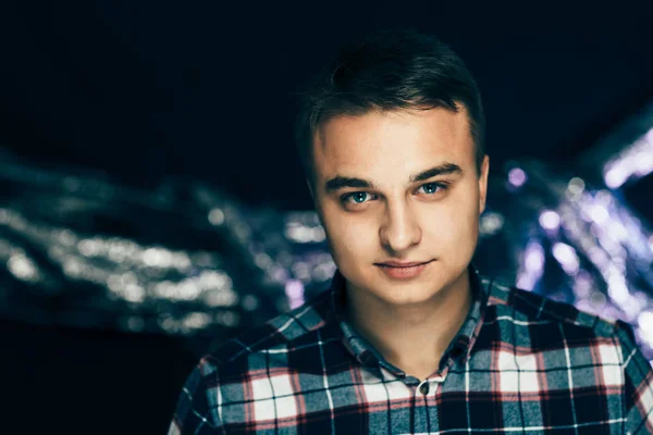 Portrait of a young man on a blurred background — Stock Photo, Image