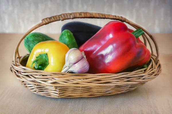 Table Wicker Basket Red Yellow Pepper Cucumbers Garlic Eggplant — Stock Photo, Image