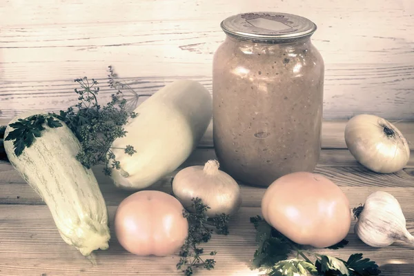 Canned squash caviar with vegetables in a glass jar. — Stock Photo, Image