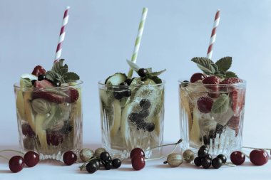 Homemade summer refreshing cocktail of fruits and berries. clipart