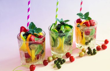 Homemade summer refreshing cocktail of fruits and berries. clipart