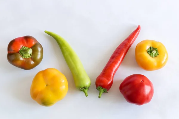 Six bell peppers on a light background. — Stock Photo, Image