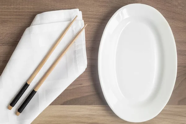 Empty White Plate Wooden Table Wooden Chopsticks Napkin Pattern Japanese — Stock Photo, Image