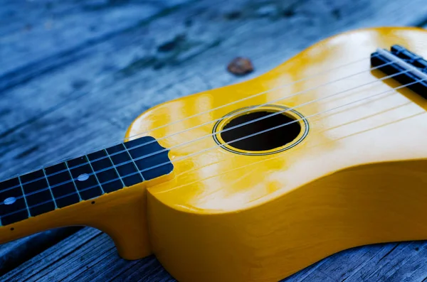 Yellow Ukulele Music Instrument Table Blure Effect — Stock Photo, Image