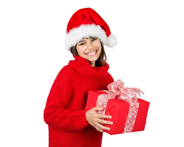 快乐和可爱的小女孩与圣诞老人帽子和红色毛衣拿着红色圣诞礼物 在白色上隔离 — 图库照片
