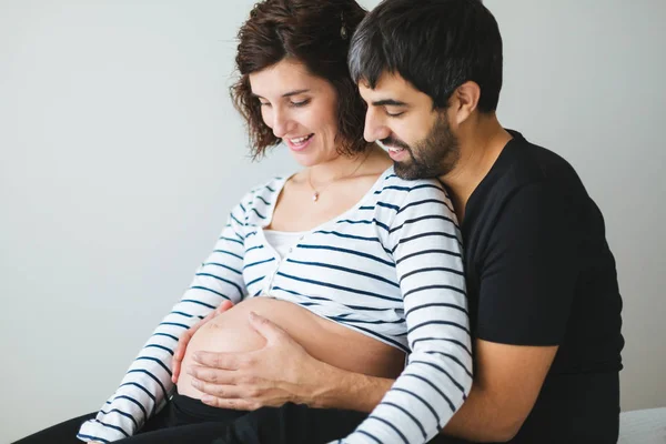 Happy Pregnant Couple Hugging Touching Womans Belly Sitting Bed Soft — Stock Photo, Image