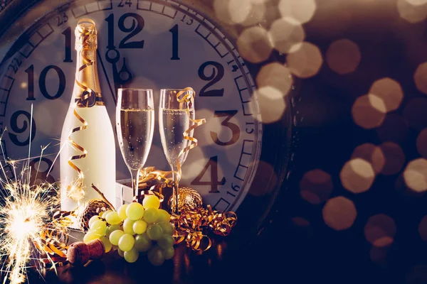 New Year party with champagne and grapes — Stock Photo, Image