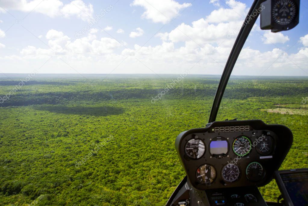 Beautiful top view of the Santo Domingo National Park, Dominican Republic from the helicopter cockpit through the blurred glass. Helicopter tour over the Dominican Republic.