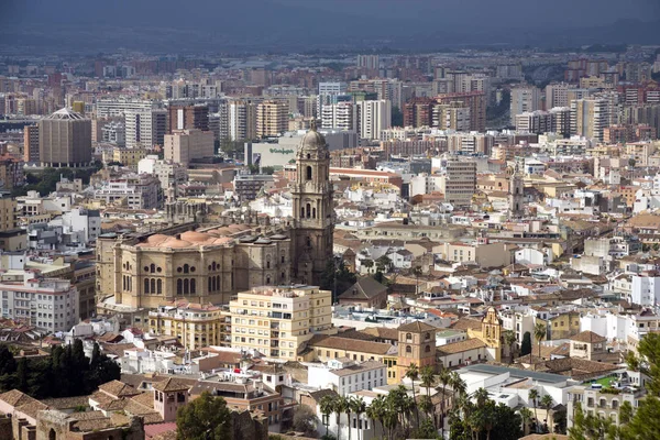 Malaga, Spain, February 2019. Panorama of the Spanish city of Malaga. Buildings  against a cloudy sky. Dramatic sky over the city. Beautiful view. — Stock Photo, Image