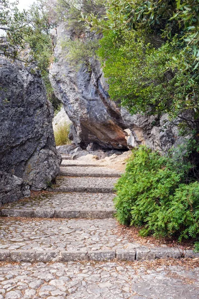 Steps, path and rocks near the walls of the amazing monastery of Santoire de Luc. The Catholic monastery on the island of Mallorca is the spiritual center of the Balearic Islands.