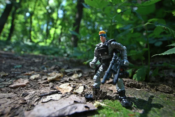 Nature forest special forces soldiers with machine gun