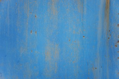 Mavi arka plan: paslı metal yüzeylere dökülüyor ve doku çatlama mavi boya ile
