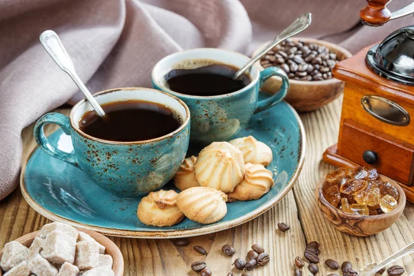 Two Blue Cups Black Coffee Cookies Sugar Pieces Surrounded Checkered — Stock Photo, Image