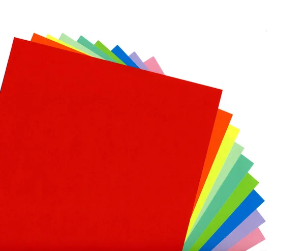 Multicolored paper on a white background — Stock Photo, Image