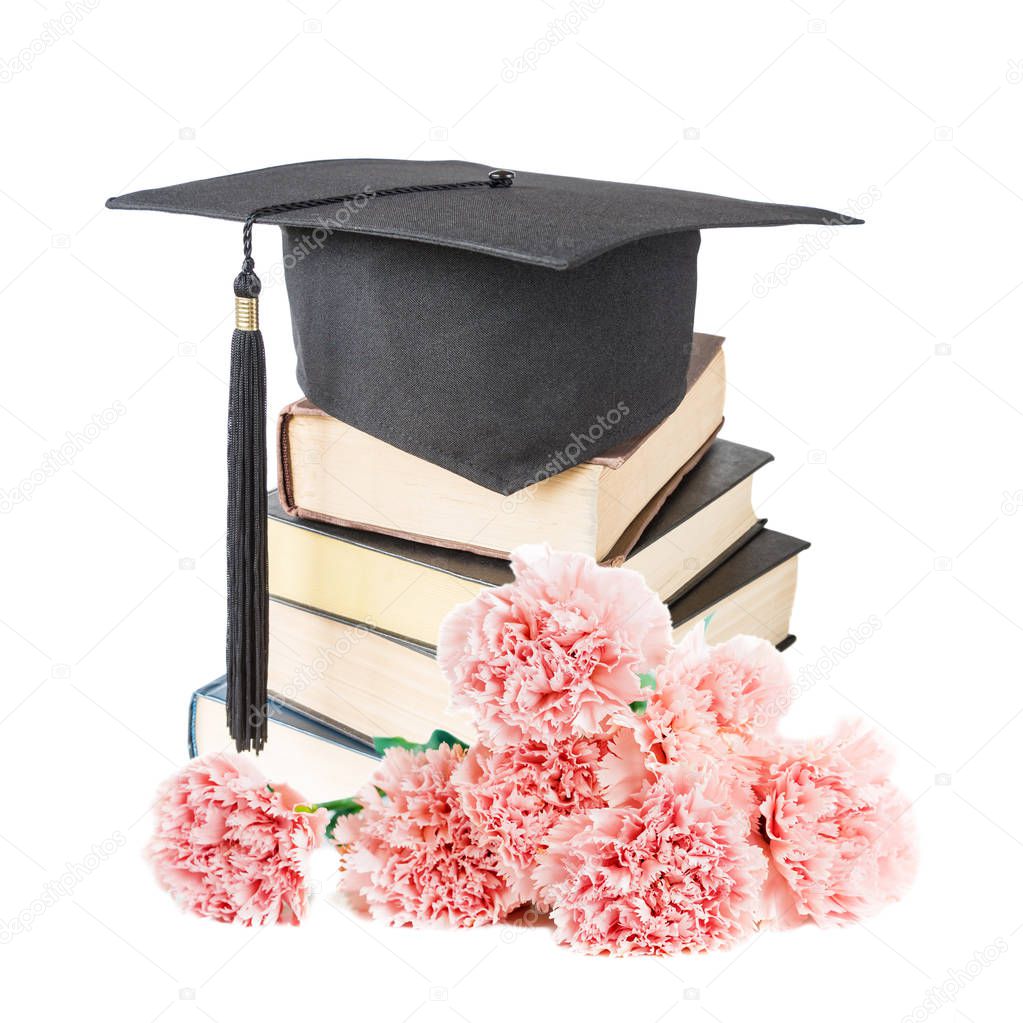 Graduate hatand books and flowers
