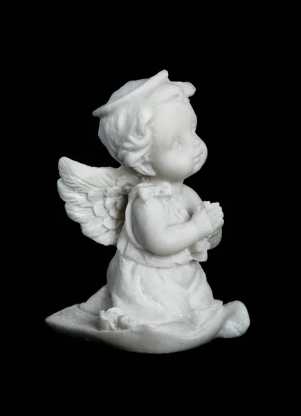Statuette av en liten ängel Stockbild