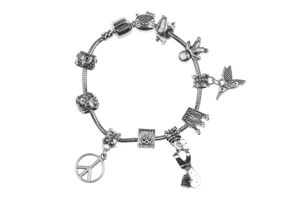 Small silver charm bracelet with many charms isolated on white background