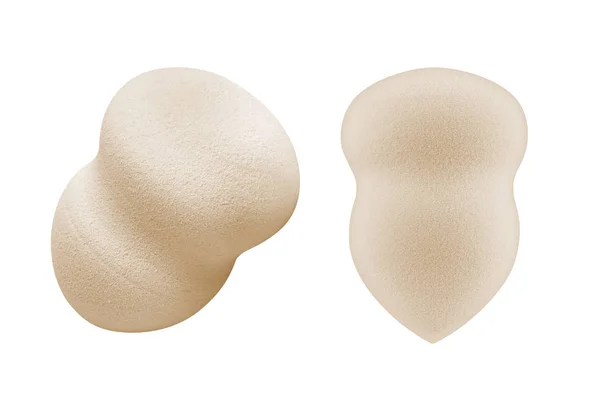 Two beige cosmetic sponge pads for applying face make-up, isolated on white background, clipping path included