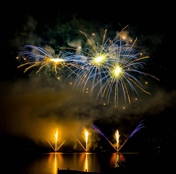 Fireworks fired over the water surface