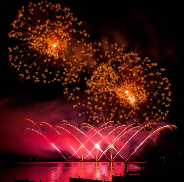 Fireworks fired over the water surface