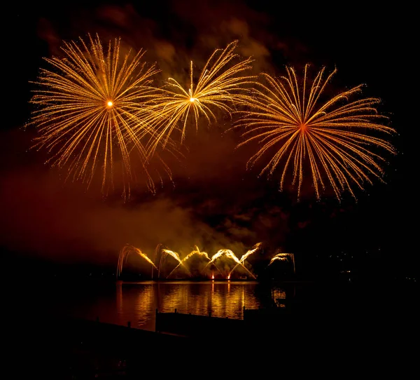 Fireworks fired over the water surface