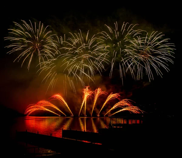 Fireworks fired over the water surface